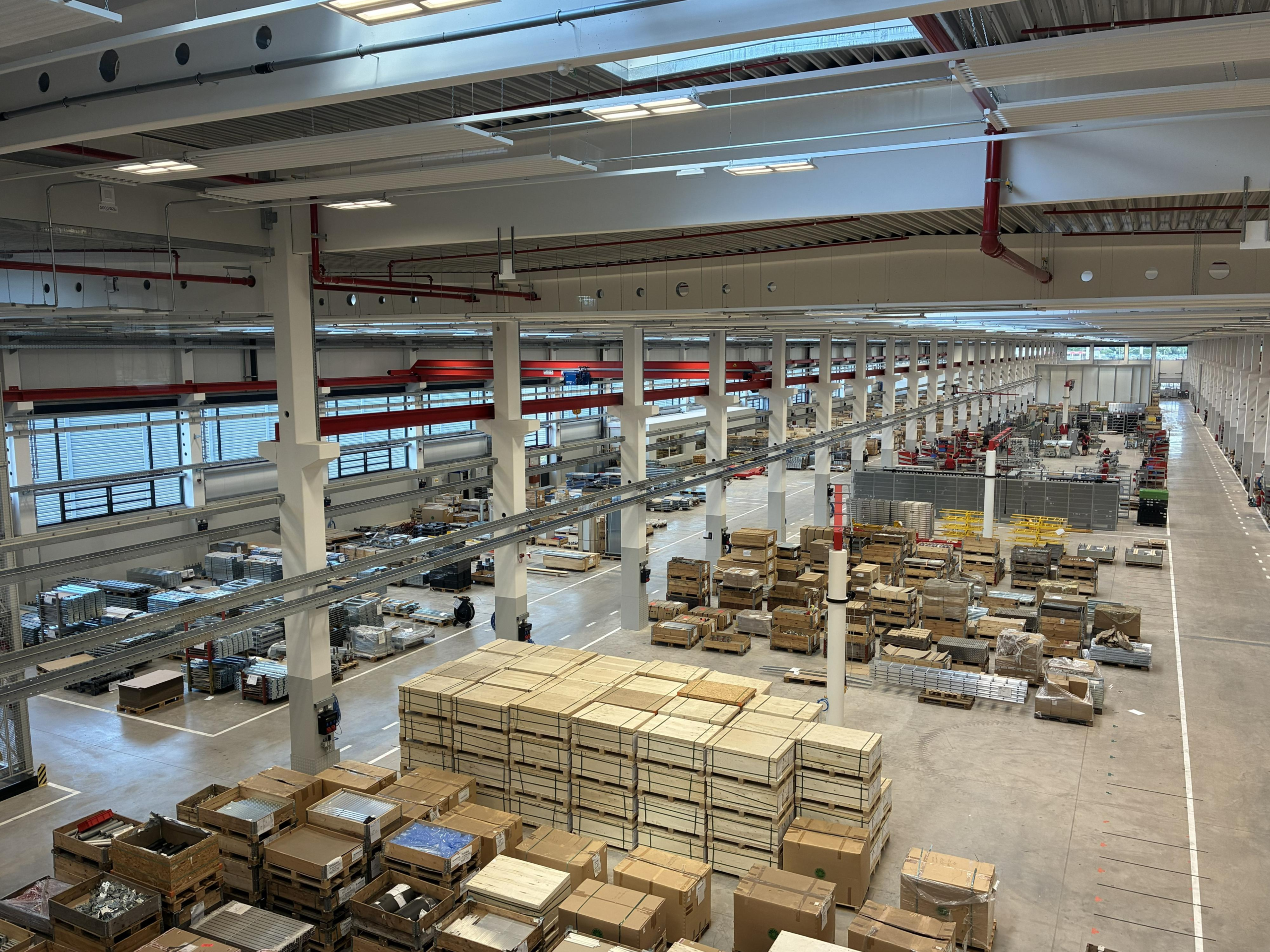 TGW automates the factory behind the warehouse TGW automates the factory behind the warehouse